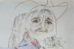  Sí, se puede (Yes, we can),  2025, hand-stitched human hair, specialty fabric, machine sewn thread, hand-sewn thread, yellow ochre pastel, tan felt, crochet piece, 32” x 58”, Photography by Mariah Richstone