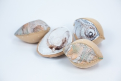 Seeds, 2026, hand-stitched and machine-sewn, specialty fabric, thread, adhesive bra cups, 6\" x 4\" x 2\" each — Photography by Mariah Richstone